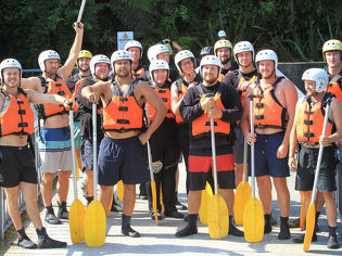 Leading Edge team photo in life jackets with padles