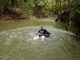 Leading Edge team member sitting in stream